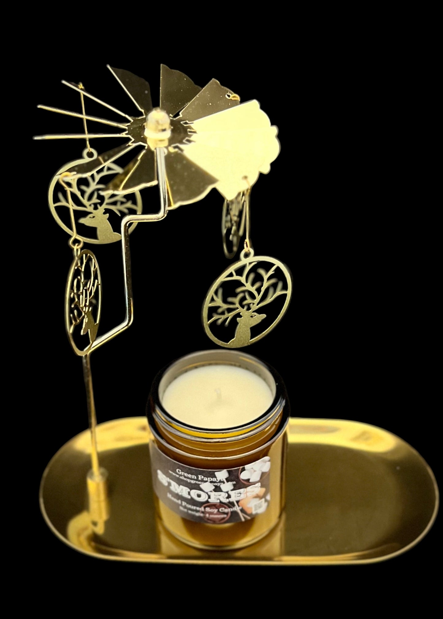 Decorative candle holder with a candle on a black background