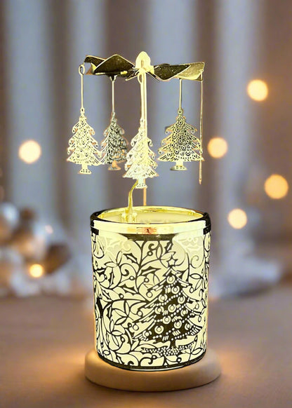 Decorative candle holder with Christmas tree design and hanging earrings on a black background