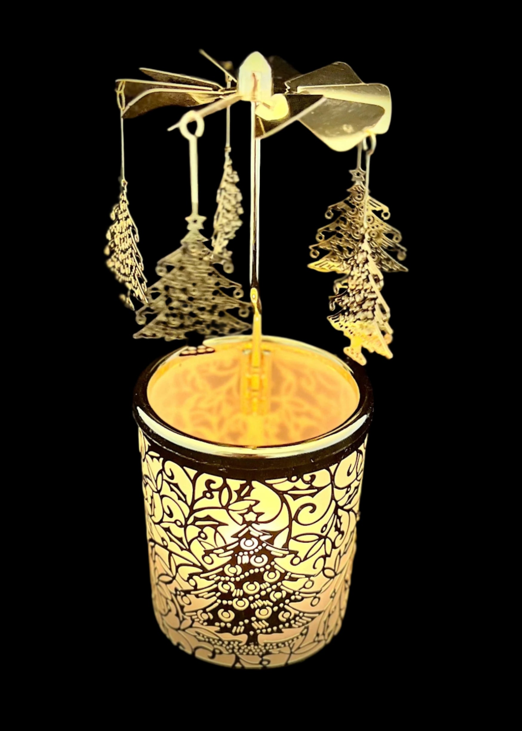 Decorative item with hanging ornaments and a glowing base on a black background