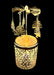 Decorative item with hanging ornaments and a glowing base on a black background