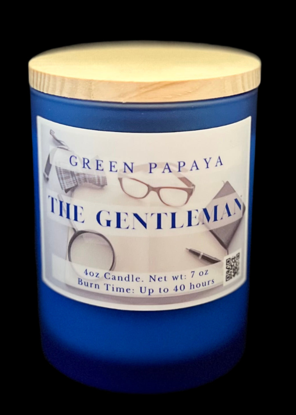 Blue candle with a wooden lid labeled 'The Gentleman' by Green Papaya on a black background