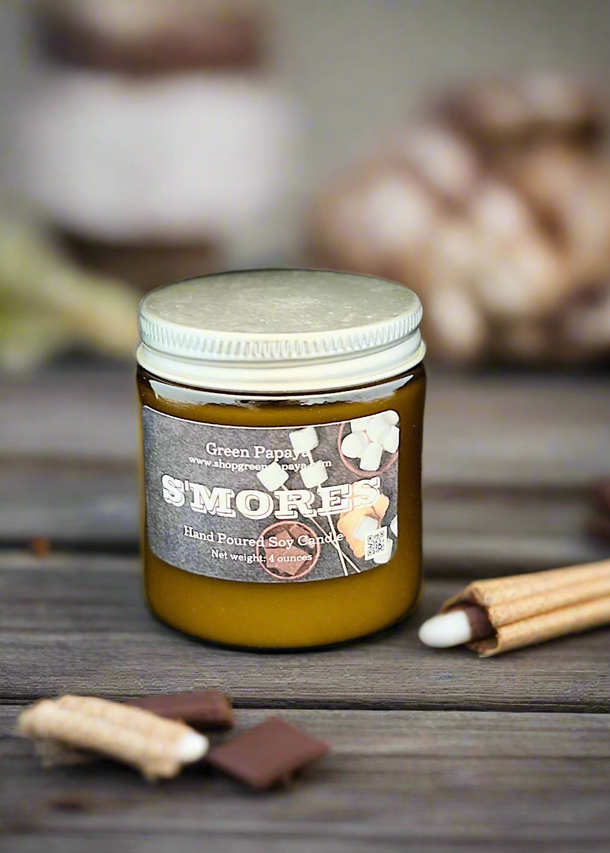 Jar of 'S'mores' candle with a label on a dark background