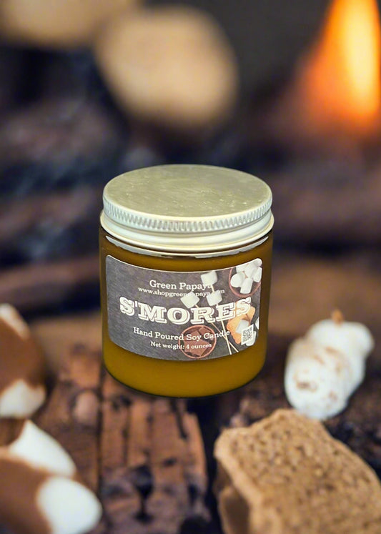 Jar of 'S'mores' candle with a gray label on a dark background