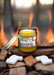 Jar of 'S'mores' candle with a label on a black background