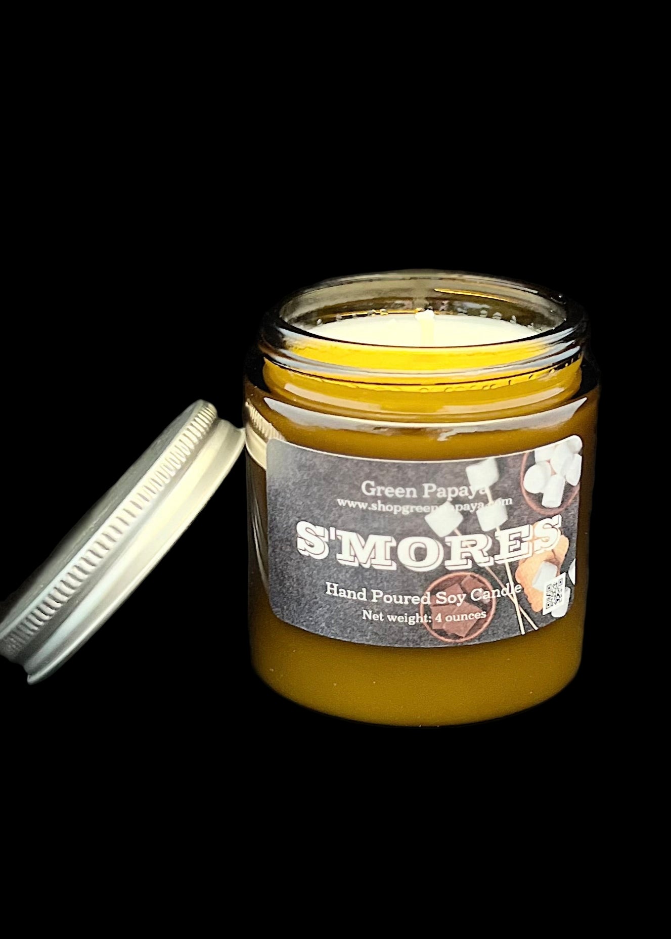 S'mores candle in a jar with a label on a dark background