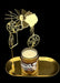 Decorative candle holder with a candle on a black background