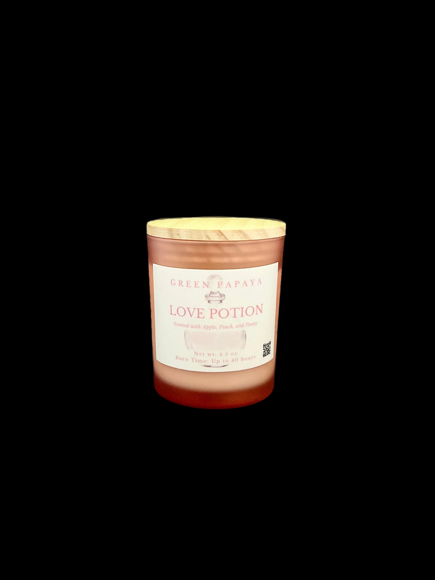 A single candle jar labeled 'Green Papaya Love Potion' by Green Papaya, set against a solid black background.
